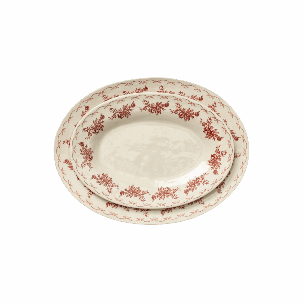 Two oval ceramic serving platters with red floral patterns, perfect for hosting, one smaller platter nested inside a larger platter, on a white background.
